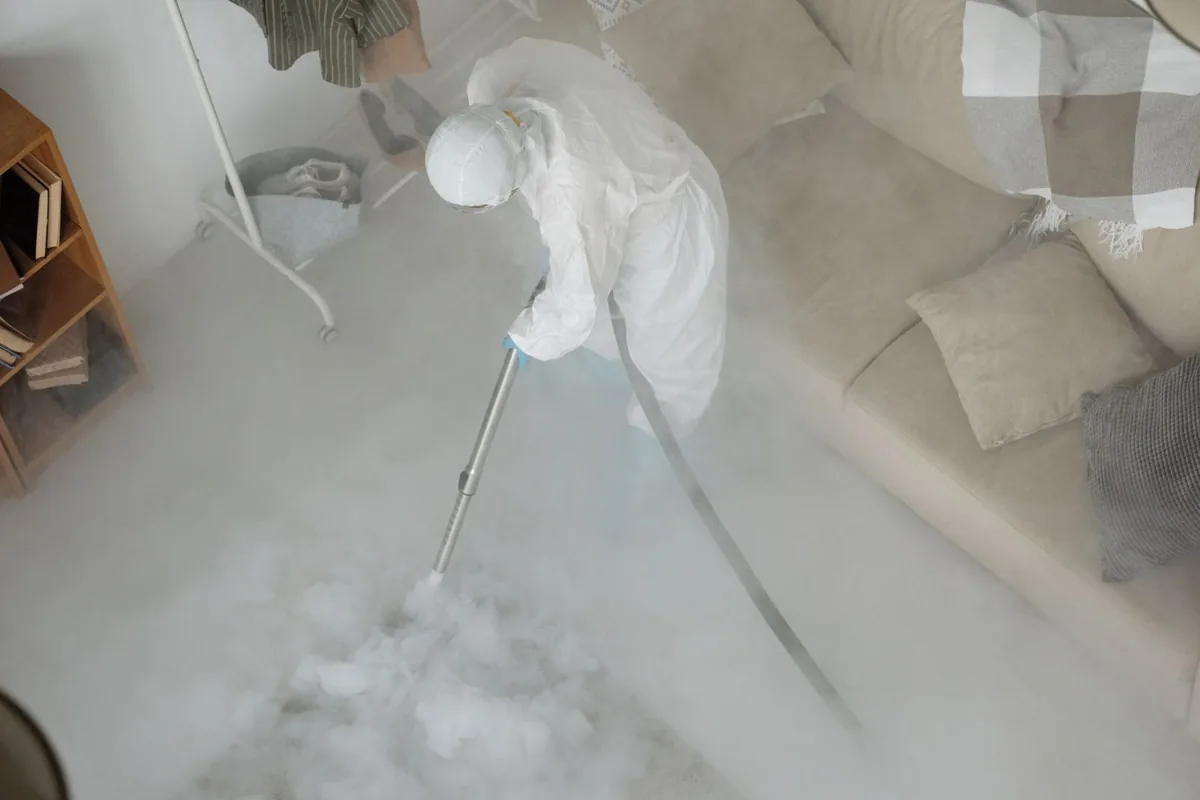 Biohazard cleanup technician in protective equipment, Lesslie, SC